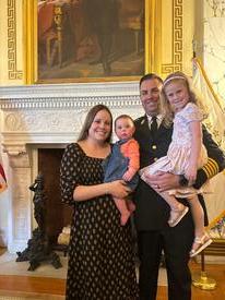 Chief Andrew Kettle with his wife Lauren and daughters Kinsley and Cora pause at the State House after the awards. 