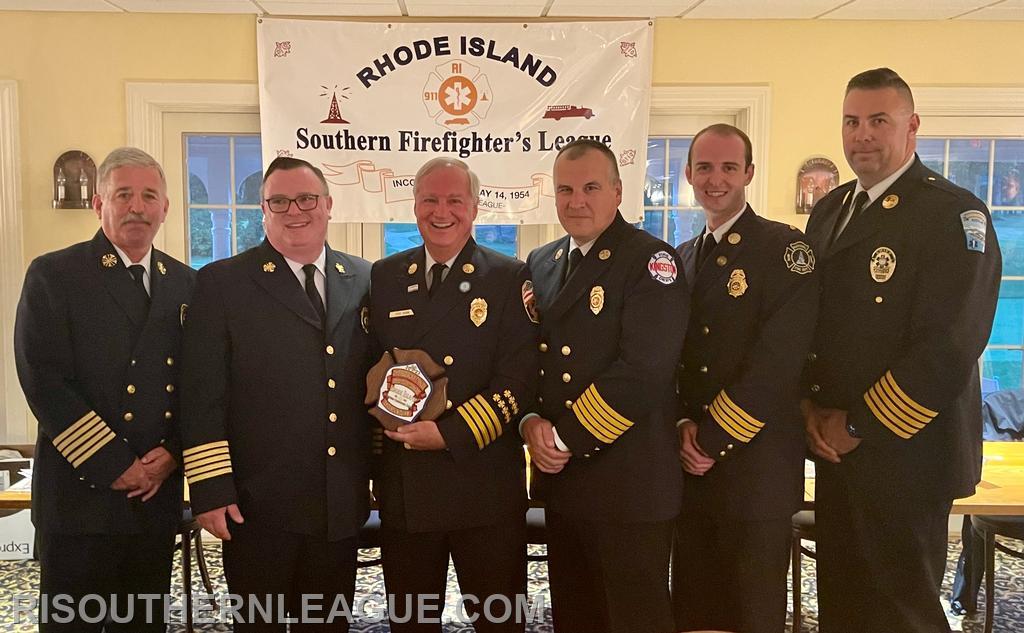 League Director Chief John Mackay, President Chief Justin Lee, Chief Quinn, League VP Chief Tom Reed, League Secretary AC Chris Koretski, and League Treasurer Chief Andrew Kettle pose following the award portion of the evening. 