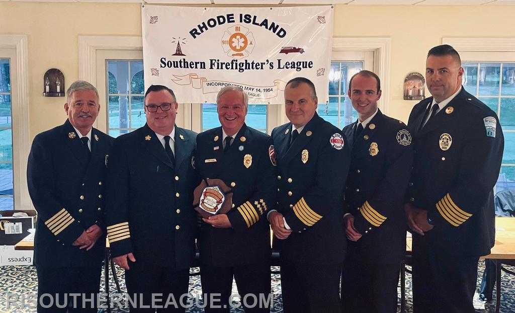 League Director Chief John Mackay, President Chief Justin Lee, Chief Quinn, League VP Chief Tom Reed, League Secretary AC Chris Koretski, and League Treasurer Chief Andrew Kettle pose following the award portion of the evening. 