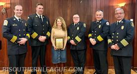Rep. Tina Spears with the League Board of Directors after receiving the Legislator of the Year award. 
L-R: Asst. Chief Koretski, Chief Kettle, Rep. Spears, Chief Lee, Chief Reed, and Chief Mackay
